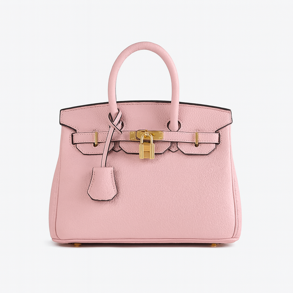 Structured leather tote bag with top handles, spacious interior, detachable shoulder strap, and sleek minimalist design for work or travel