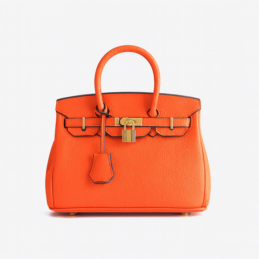 Structured leather tote bag with top handles, spacious interior, detachable shoulder strap, and sleek minimalist design for work or travel