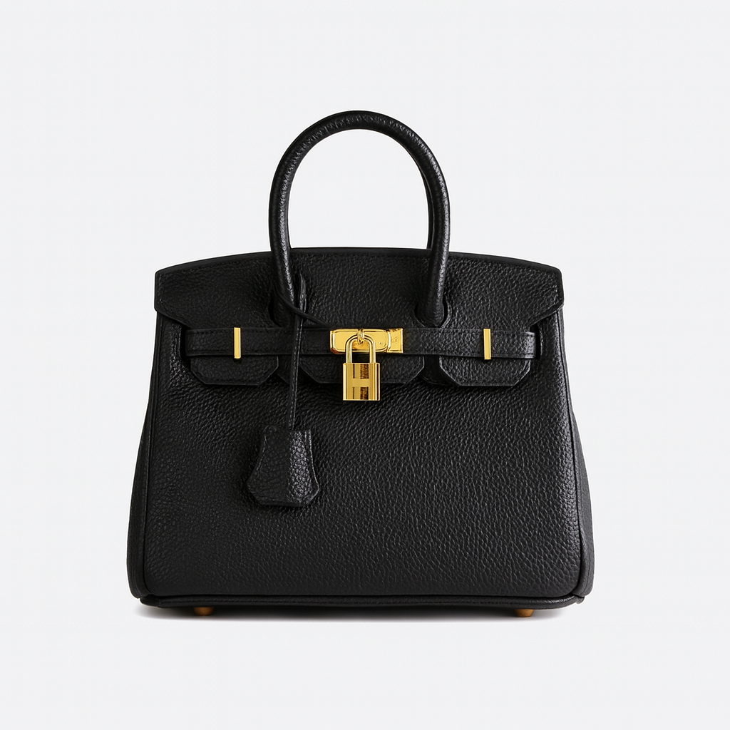 Structured leather tote bag with top handles, spacious interior, detachable shoulder strap, and sleek minimalist design for work or travel