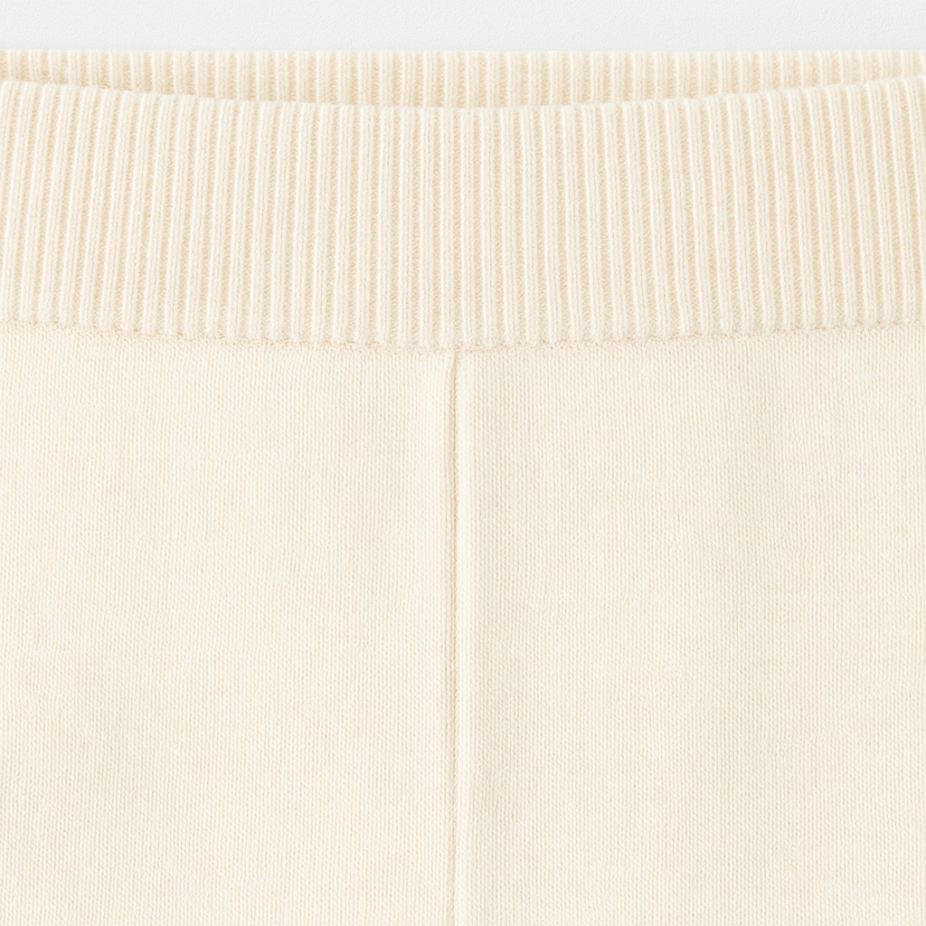 Women’s wide-leg knit pants with a high-rise waist and soft draped fit for relaxed all-day wear.