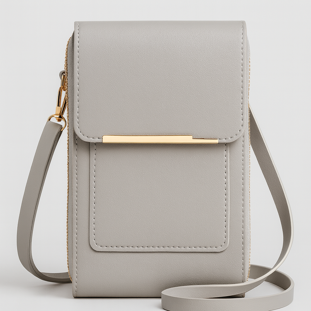 The Elina Compact Crossbody Bag in smooth leather with adjustable strap, secure zip closure, and lightweight minimalist design, ideal for daily wear and travel