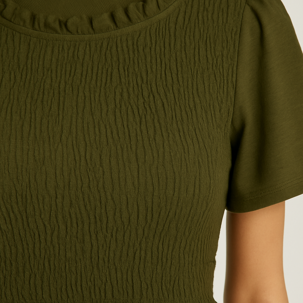 Olive green smocked crop top with flutter sleeves and ruffle trim.
