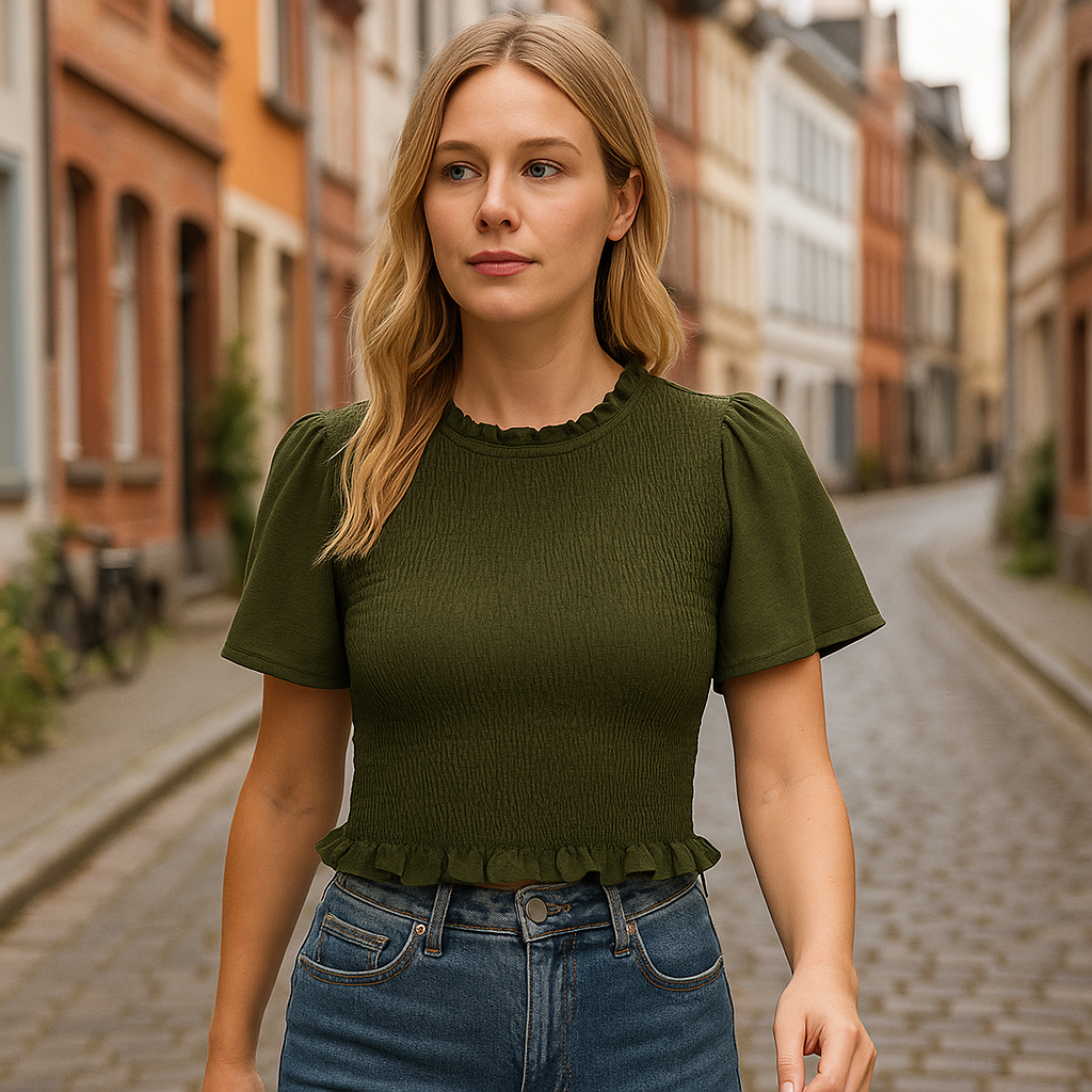 Olive green smocked crop top with flutter sleeves and ruffle trim.