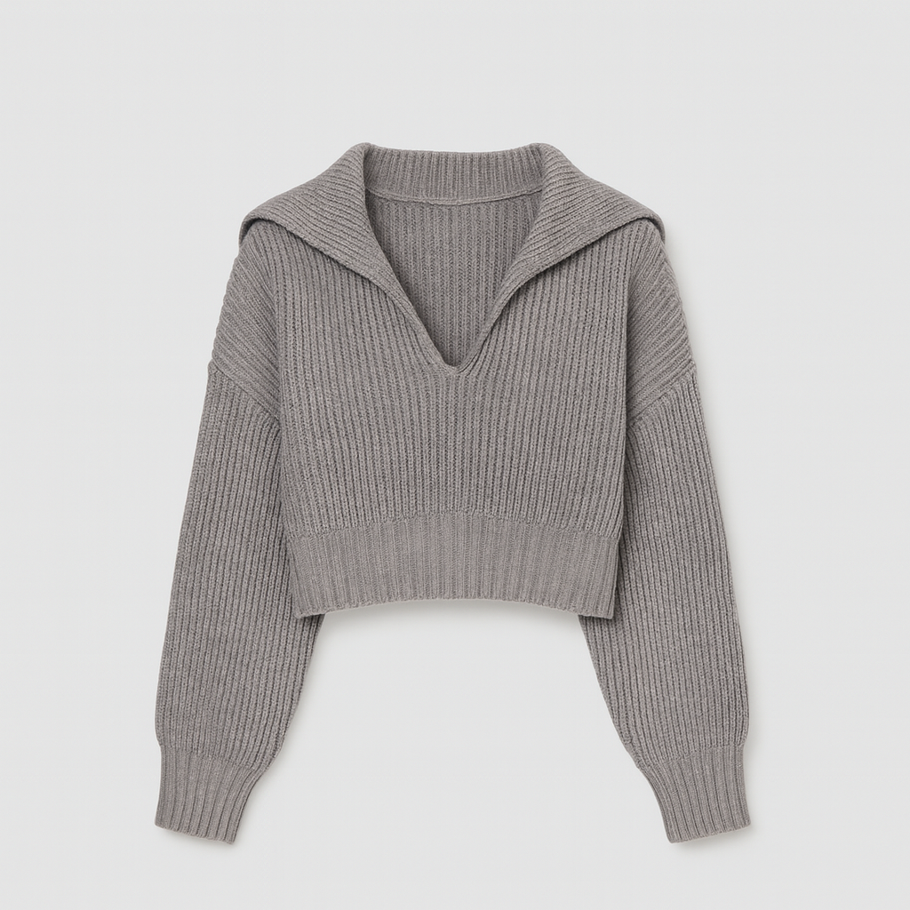 Grey ribbed knit cropped sweater with V-neck and collar detail.