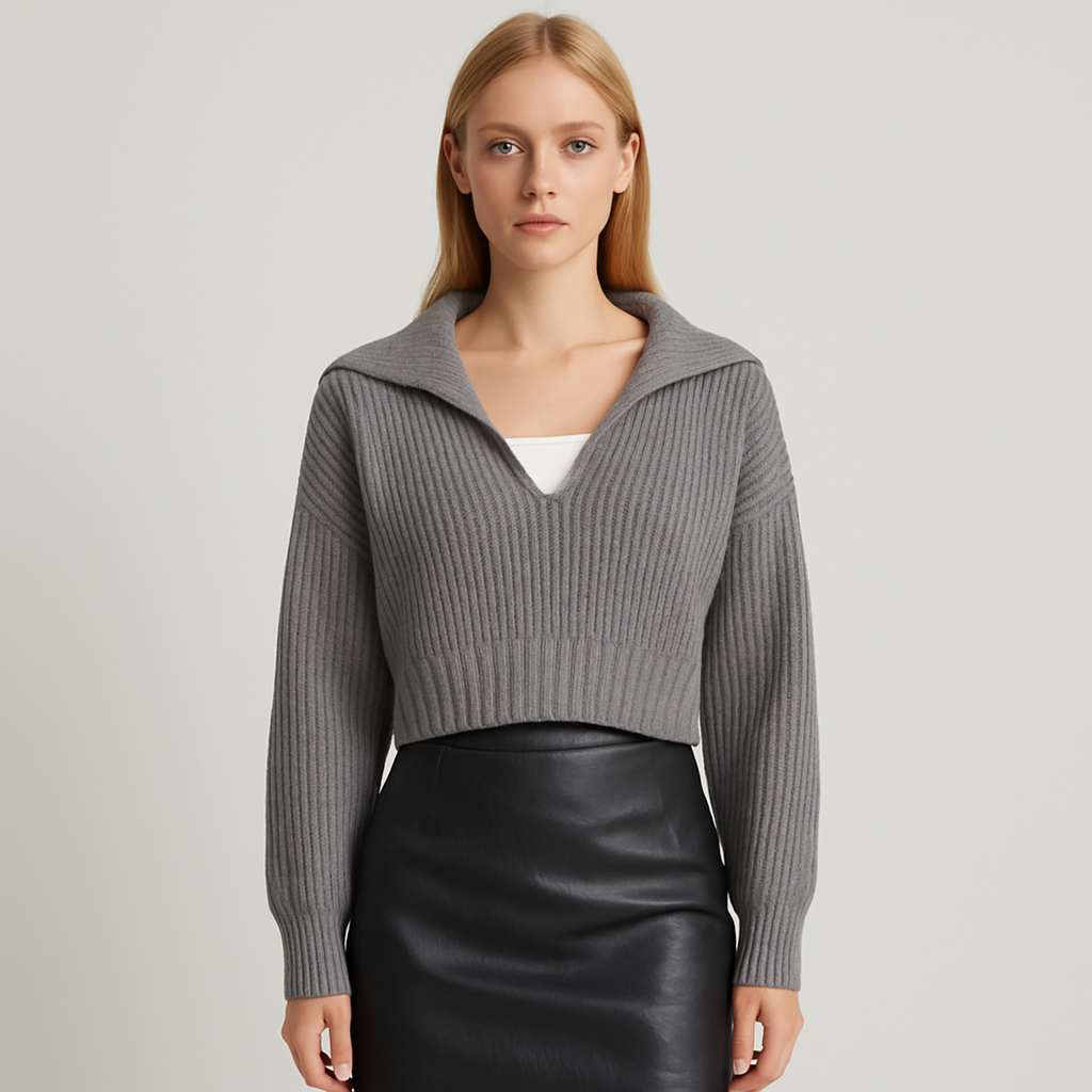 Grey ribbed knit cropped sweater with V-neck and collar detail.