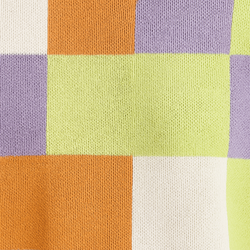 Multicolor checkered knit top with orange, purple, green, and white squares.