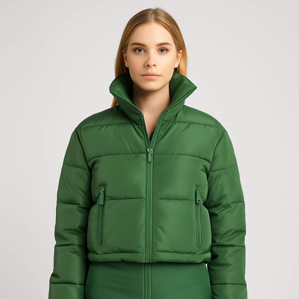 Green cropped puffer jacket with high collar, front zipper closure, and zippered pockets.