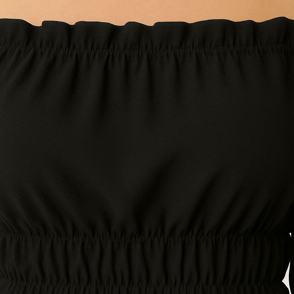 Black off-shoulder ruffle crop top with long flared sleeves and ruched waist.