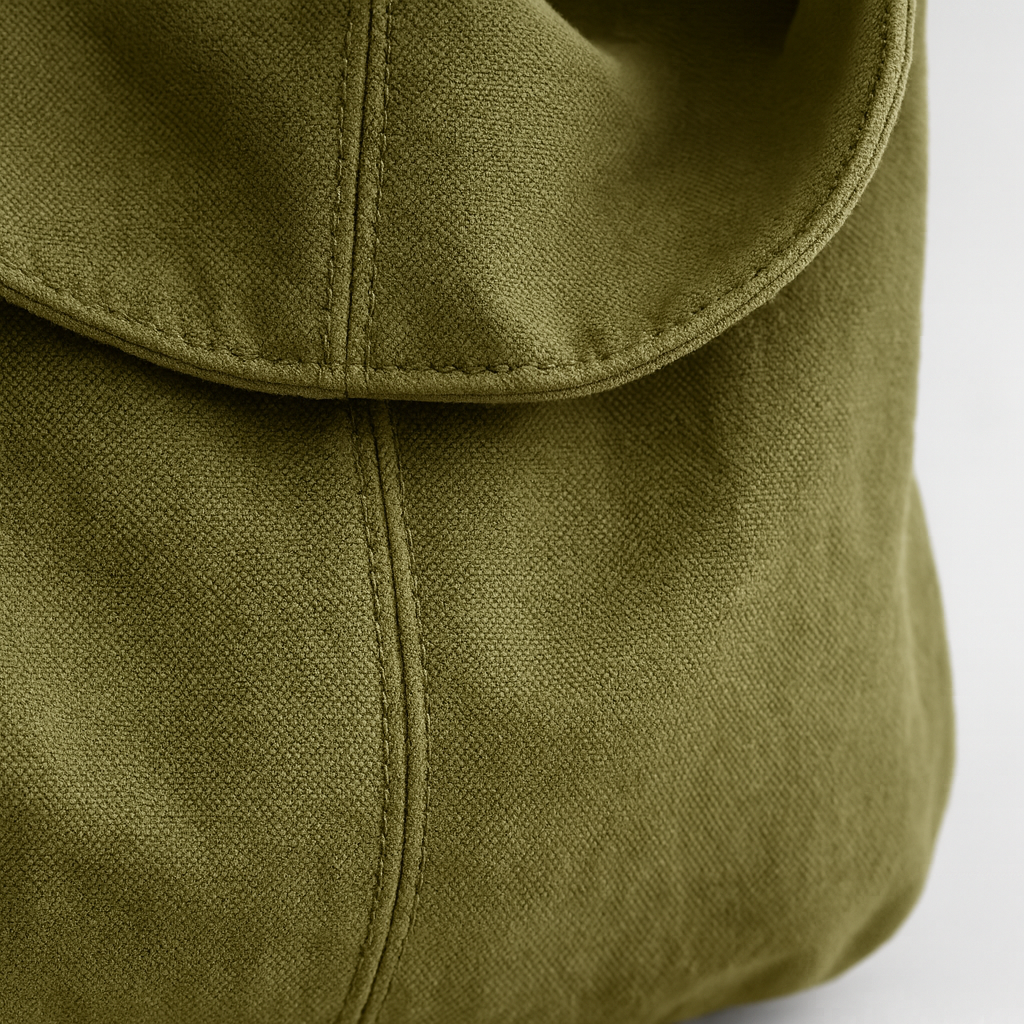 Canvas shoulder bag with oversized silhouette, soft shoulder strap, and spacious interior.