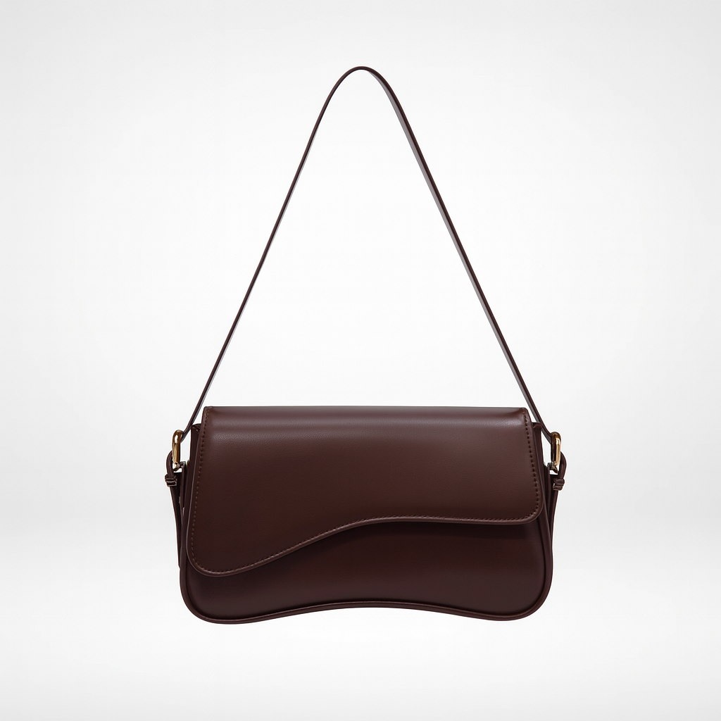 Curved flap shoulder bag with smooth leather finish, adjustable strap, magnetic closure, and sleek minimalist design for everyday wear