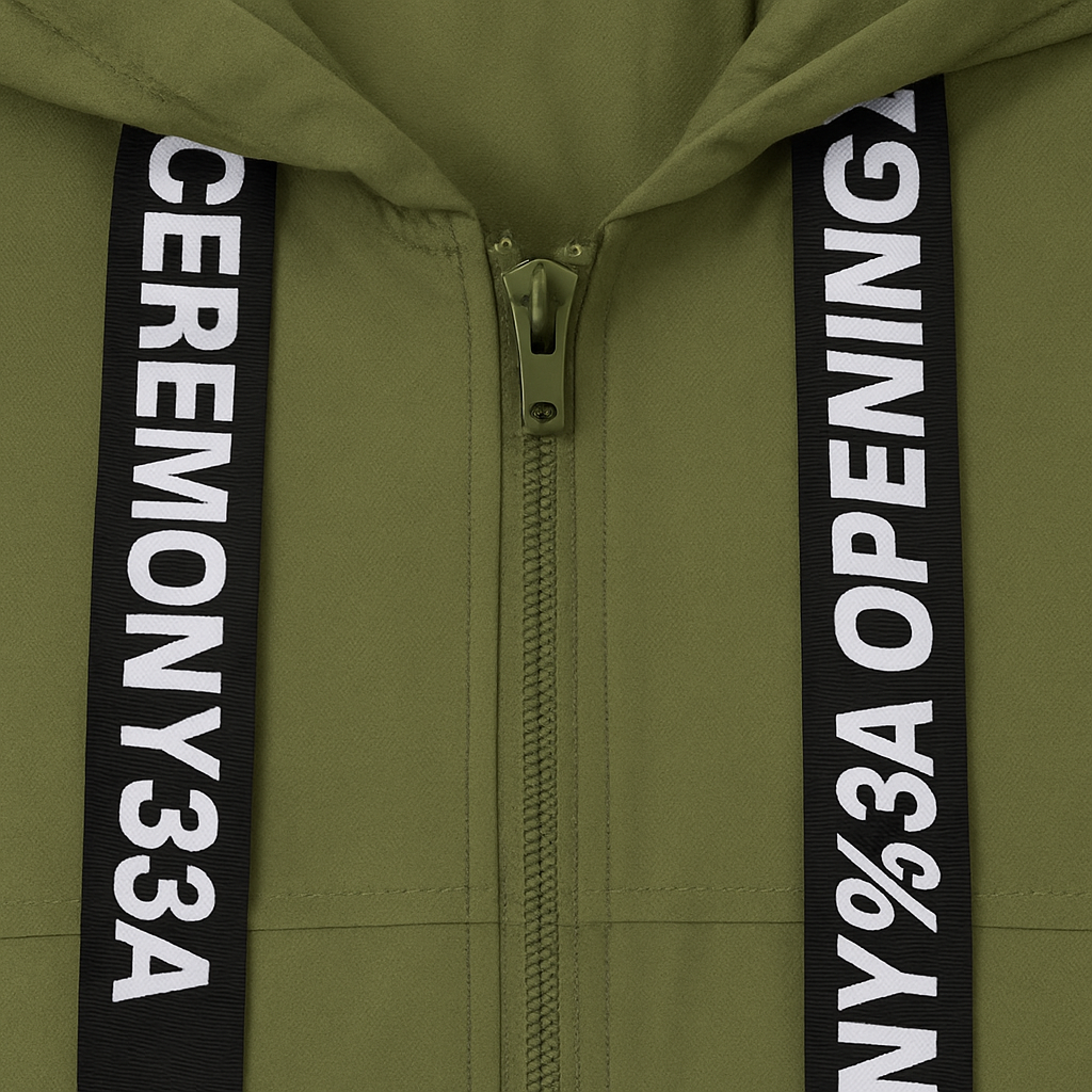 Olive green hooded utility jacket with zipper closure, flap pockets, and black printed drawstrings.